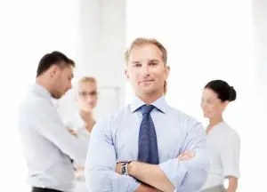 A man standing in front of other people.